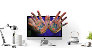 Hands with keywords coming out of a screen