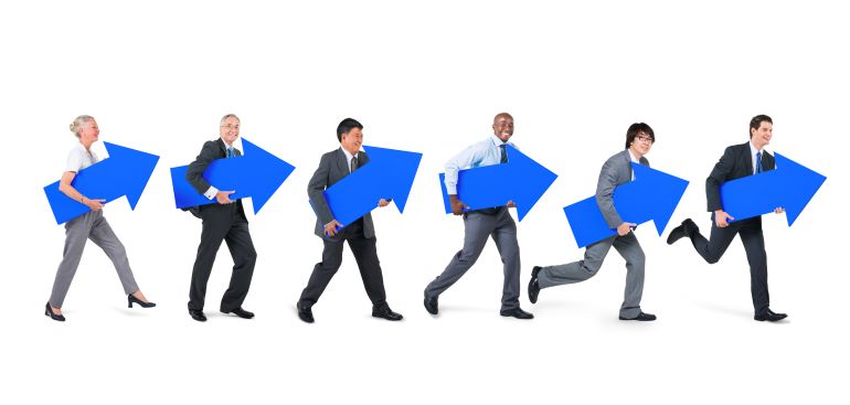 Different people carrying blue arrows pointing upwards.