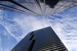 Business building reaching for the sky - climb to the top with good online reputation management.