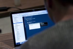 Web developer working on a laptop.