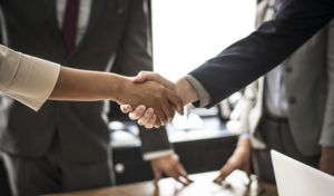 Business people shaking hands.