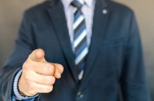 Businessman pointing a finger