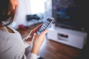 A responsive web design benefits your SEO by making it easy for people to browseyour website, like the girl on this photo.