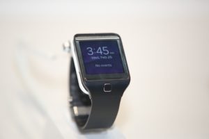 Smart watch on a white table.