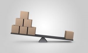 Boxes on one side and a single box on the other side of a scale.