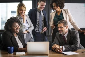 Businesspeople discussing things online, while using one of the top team collaboration tools.