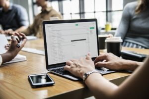 A woman sending emails.