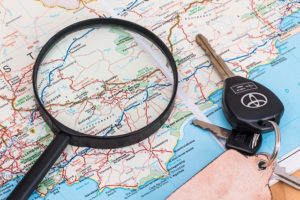 A map with car keys on it.