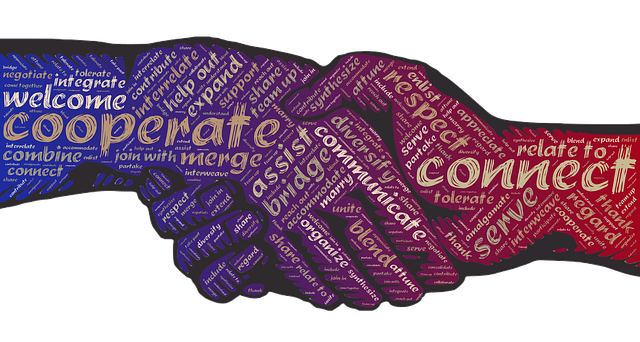 Two hands in a handshake, made of crucial words for any business.
