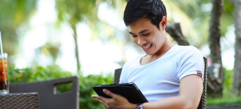 A happy customer looking a commercial on their tablet relevant to them, showing why marketers are turning to location data.