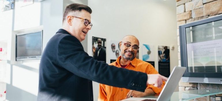Man pointing at laptop