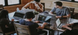 Multiple employees working at their desks in one office