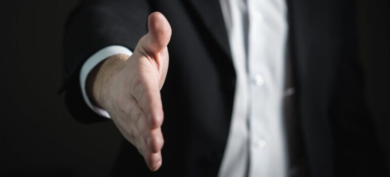 A close-up of a man's extended hand.