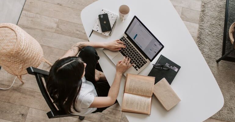 Woman researching different SEO solutions.