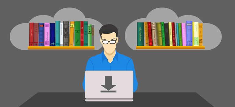 A person doing research on a laptop.