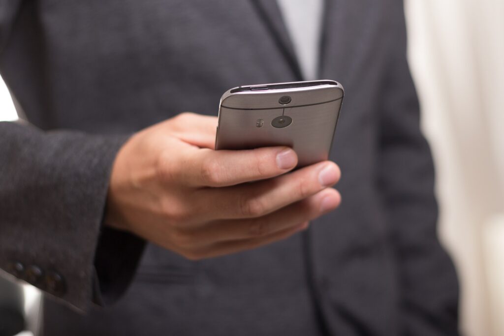 A person holding a mobile phone