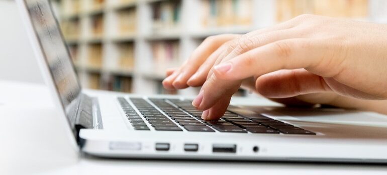 Person typing on a laptop.