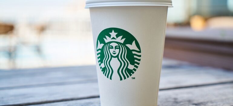 Starbuck cup with Starbucks logo.
