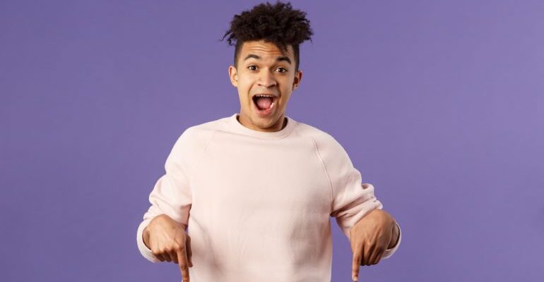 Enthusiastic person and purple background.
