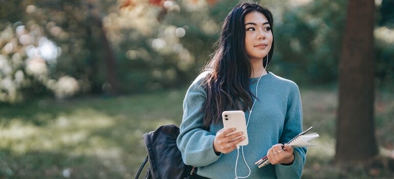 Young person using a screen reader for their phone.
