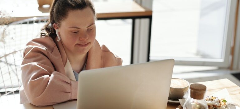 A person with Down syndrome relies on web accessibility in SEO to browse a website.
