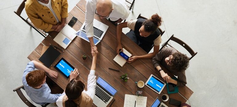 People in a meeting, discussing the importance of having a sales pipeline.