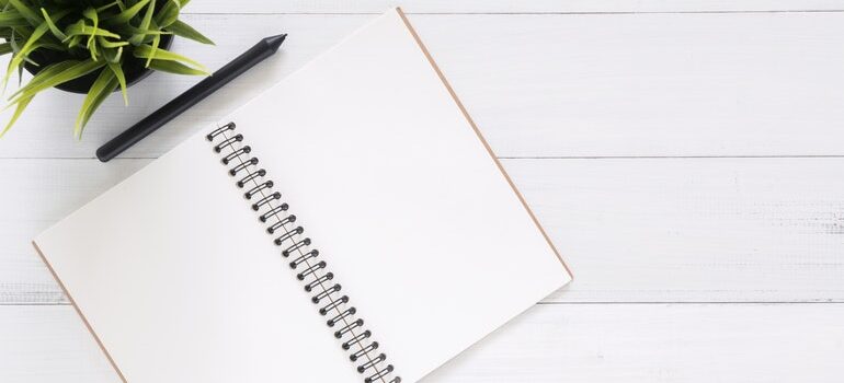 Notebook and pen on a desk.