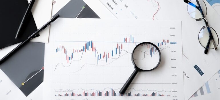 A magnifying glass on a printed graph.