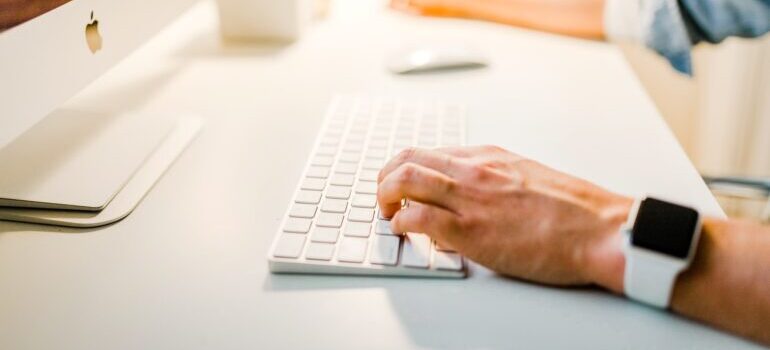 person typing on keyboard